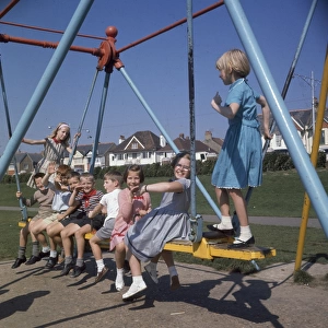 Children on a swing in a park