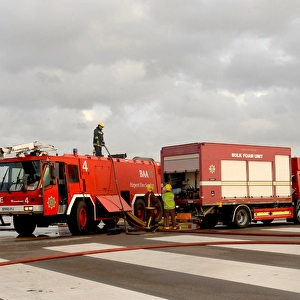 Fire crews attend the aftermath of a plane crash