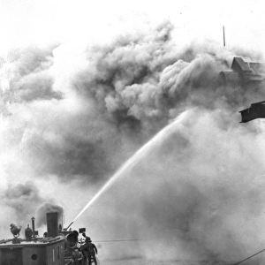 A fireboat tackling a blaze on the River Thames