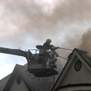 Firefighter working from hydraulic platform
