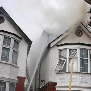Firefighters in action at house fire, Golders Green