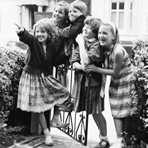Group of children at a gate, Balham, SW London