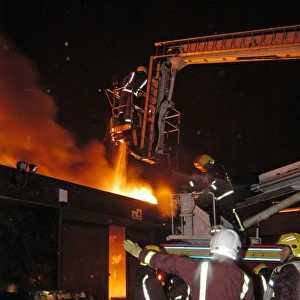 Hydraulic platform at work on fire at commercial premises