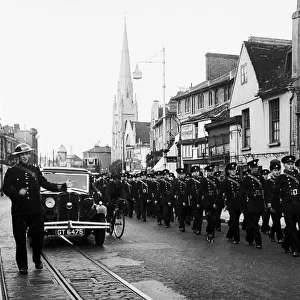 London firefighters marching in SE London street, WW2