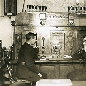 Two men on switchboard at LFB HQ