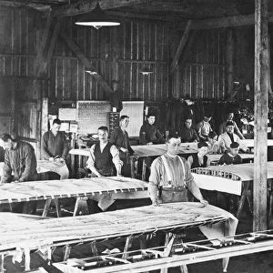 Men Working on Wing in the Fabric Covering Workshop at t?