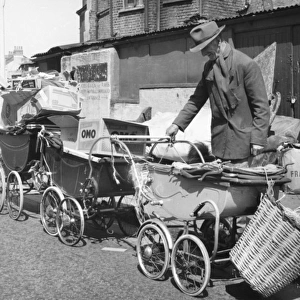 Old man with prams and junk, Balham, SW London