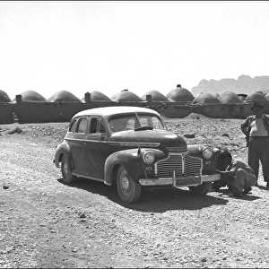 Two people and their car in Iran