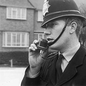 Police officer using a radio, London