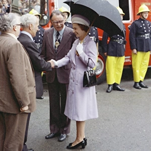 Queen Elizabeth II inspecting firefighters