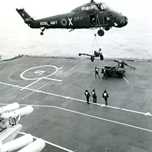 A Royal Navy Westland Wessex HU5, XT485, lifts supplies ?