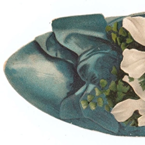 White flowers in a shoe-shaped Christmas card