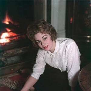 Woman on Rug by Fire