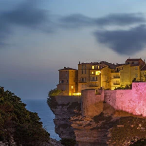 Night view of the Citadel and old town of Bonifacio perched on rugged cliffs, Bonifacio