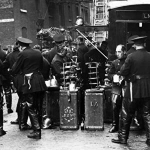Firefighters on refreshment break, Wapping, East London