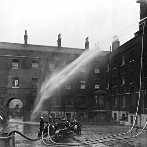LCC-London Fire Brigade, motorised pump at hose drill