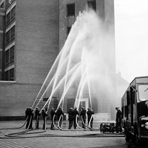 LFB firefighters in multi-hose display