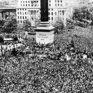 WWII: V-E DAY, 1945. Crowd gathered in Trafalgar Square in London, England, to