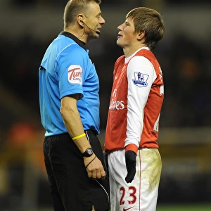 Andrey Arshavin (Arsenal) jokes with referee Mark Halsey. Wolverhampton Wanderers 0