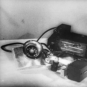 A photo electric device and multiplier controlling the use of batteries used in sputnik 2, the larger device is the other radio transmitter, while the satellite was in the shadow of the earth, electric current was cut off to economise the heavy drain on the batteries and switched on again when the satellite emerged into the sunlight, 1957