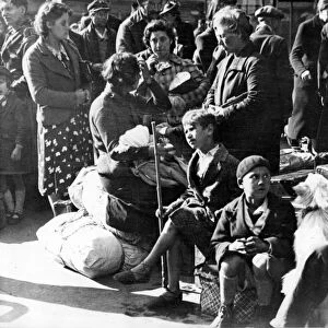 World War II: Paris, July 1940: Belgian refugee families waiting at the Gare du Nord