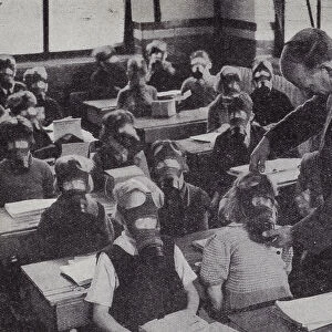 British schoolchildren practicing putting on their gas masks, World War II, 1939-1945 (b / w photo)