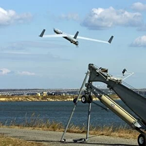 A ScanEagle unmanned aerial vehicle launches from a catapult