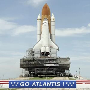 Space shuttle Atlantis approaches the top of Launch Pad 39A at Kennedy Space Center