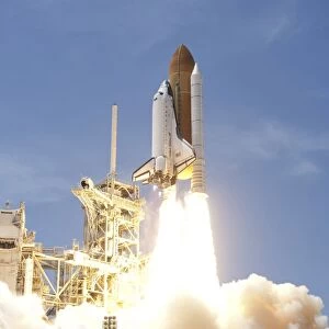 Space shuttle Atlantis twin solid rocket boosters propel to launch the spacecraft