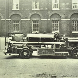 Firemen aboard a foam tender, London Fire Brigade Headquarters, London, 1929
