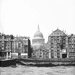 Lighters passing St Pauls Wharf with St Pauls Cathedral in the background, London, c1905