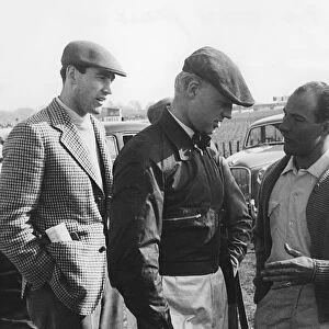Mike Hawthorn and Stirling Moss chatting at Goodwood 1956. Creator: Unknown