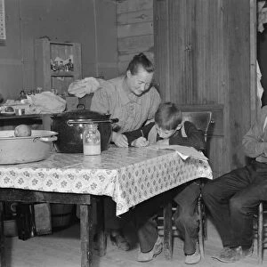 The Wardlow family in their dugout basement home on Sunday, Dead Ox Flat, Oregon, 1939. Creator: Dorothea Lange