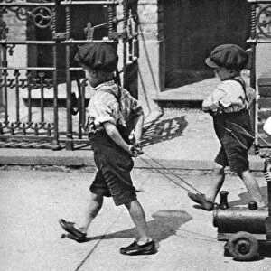 Young children playing in the street, London, 1926-1927