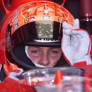 Australian GP: Michael Schumacher Ferrari F1 2001 signals for his engine to be started for the first timed practice of 2001