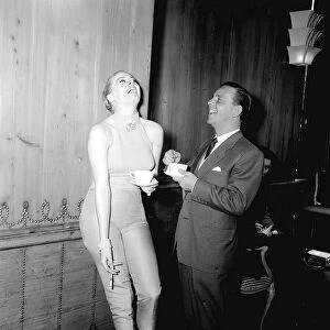 Actor and comedian Norman Wisdom with actress Anita Ekberg at the savoy Hotel in London