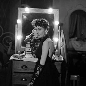 Actress Valerie Hobson in her dressing room preparing for a performance on the London