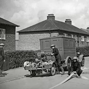 Auxiliary fire service unit in action during the A. R. P. exercises at Derby 15th May 1939