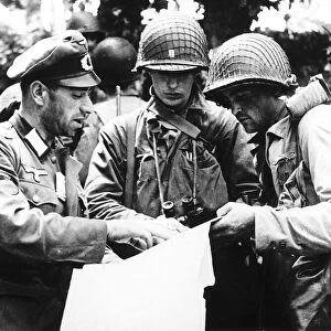 German officer (a Georgian) explaining details of a military map to US officers from