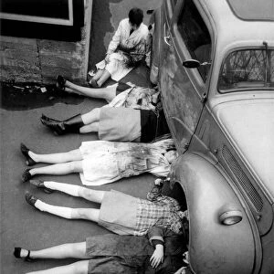 A group of Norwood Girls School pupils having a car maintenance lesson