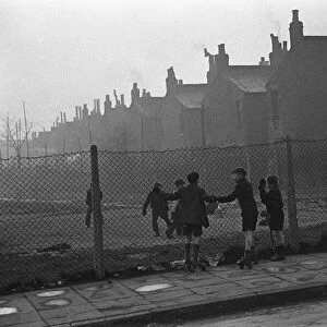 Life in the Mirror Our Gang. 19th January 1954 Boys playing football watched on by