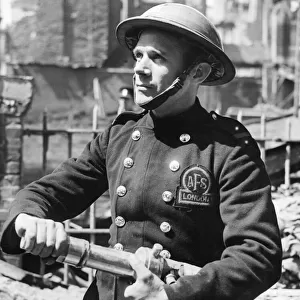 A member of the The Auxiliary Fire Service (AFS) in London