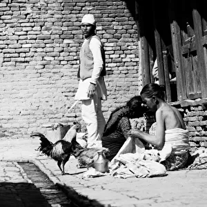Nepalese family seen here on the streets of Katmandu with their chickens