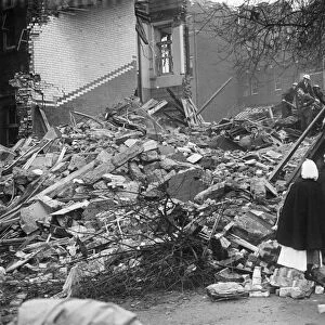 Nurses stand and look at the rubble that is now St Giles Hospital in Camberwell