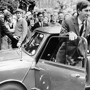 Prince Charles and Mini car arriving at Trinity College in 1967