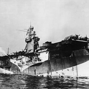 The Royal Navy escort carrier HMS Pursuer arrives at a British port during the Second