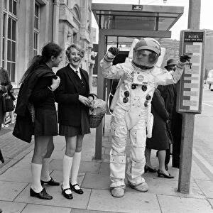 Spaceman in London streets. Jonathan Bosley, dressed in a space man suit as used by
