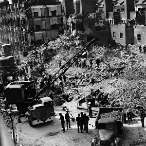 Workmen search a building at Elephant and Castle London which was hit by a German bomb