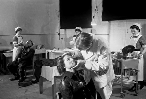 Blitz in London -- AFS personnel receiving treatment, WW2