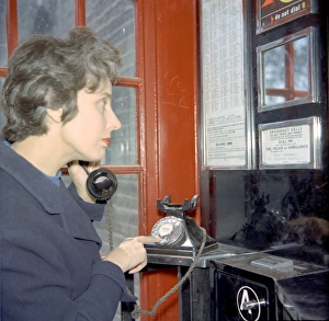 <b class=qtipBold><figcaption>Example of a woman dialling 999</figcaption></b><br>Example of a woman dialling 999 for the emergency services in a red telephone booth.<br><em>© London Fire Brigade / Mary Evans Picture Library</em> Example of a woman dialling 999